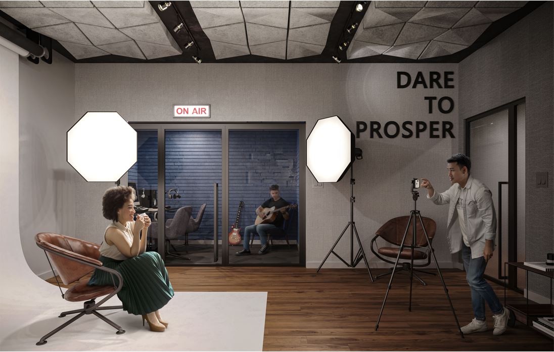 A woman is sitting in front of a white screen while a man is taking her photo with his phone. In the background, another man is playing his guitar in a smaller room.